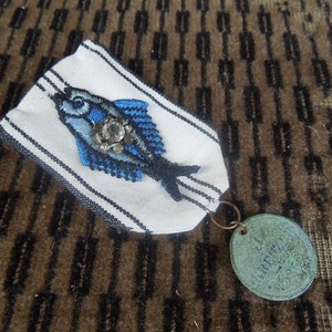 Original medal brooch for The biggest catch