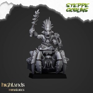 May include: A gray miniature figure of a goblin warrior riding a crab-like creature. The goblin is holding a weapon and shield. The text "STEPPE GOBLINS" and "highlands miniatures" are visible.
