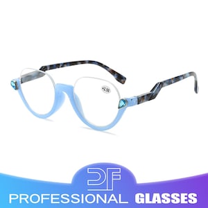 May include: Pale blue reading glasses with a semi-rimless design. The frames have a round shape with a blue gemstone accent on each side. The temples are patterned with blue and brown. The lenses have a +2.50 magnification.