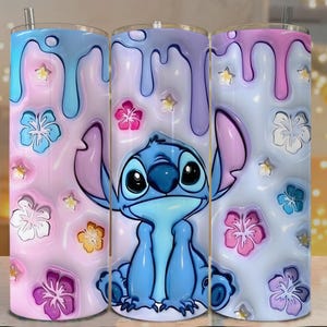 May include: A stainless steel tumbler featuring a cartoon character, Stitch, with a blue and pink color scheme. The design includes dripping paint and floral accents. The tumbler has a straw and is designed for cold beverages.