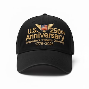 May include: Black baseball cap with gold embroidered text and a patriotic design. The text reads "U.S. 250th Anniversary" with the years 1776-2026, and includes an American flag. The cap features a curved brim and a top button.