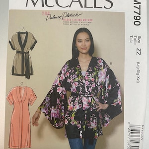 May include: McCall's M7790 sewing pattern envelope featuring the Palmer Pletsch tissue fitting method. The cover displays three garment variations: a solid tan robe with black trim, a black robe with a pink and purple floral print, and a solid peach robe.