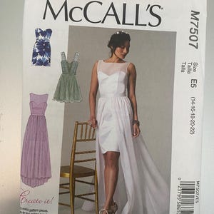 May include: McCall's M7507 sewing pattern envelope featuring illustrations of three dress variations and a photograph of a white dress with a sheer illusion neckline, a fitted bodice, and a high-low skirt overlay. The text includes M7507, Size E5.