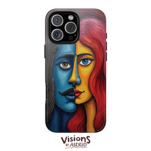 May include: A phone case with a split-face design in blue and orange. The blue side has a moustache, the orange side has red hair. The case has a black border and the text "Visions by Astrid" at the bottom.