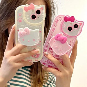 WhiskerNest Kitty Stand Case – Sanrio-Inspired Soft Shell with Built-In Bracket for iPhone 13 Series