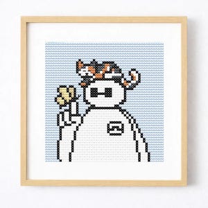 May include: Cross-stitch art in a wooden frame. The artwork depicts a white robot-like figure with a cat on its head, holding a yellow flower. The background is light blue.
