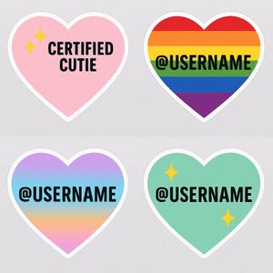 May include: Four heart-shaped stickers. One pink heart with "CERTIFIED CUTIE" text and gold stars. A rainbow heart with "@USERNAME". A heart with a pastel gradient and "@USERNAME". A teal heart with "@USERNAME" and gold stars.