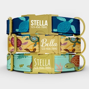 May include: Three personalized dog collars with gold-colored buckles. The collars feature sea turtle patterns in blue, yellow, and teal. Each collar displays a pet's name and a phone number in white text.