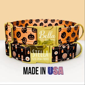 May include: Two Halloween-themed dog collars. The top collar is orange with black pumpkin faces. The bottom collar is black with candy corn and eye designs. Both have gold buckles with names and phone numbers. The words "MADE IN USA" are displayed.