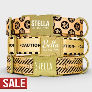 May include: Three personalized dog collars in gold with black and white patterns. One collar has a biohazard symbol, another says "CAUTION", and the third has an exclamation point. Each collar has a name and phone number.