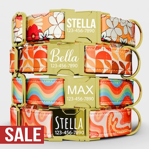 May include: A stack of dog collars with gold-colored buckles and patterned fabric. The collars feature names and phone numbers, with floral, geometric, and wavy designs in orange, red, and blue. The word "SALE" is visible.