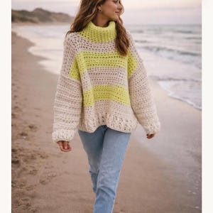 May include: A chunky crochet sweater featuring a high turtleneck collar and long sleeves. The garment displays a horizontal striped pattern in alternating bands of cream and neon yellow yarn, crafted with a visible, textured stitch throughout.