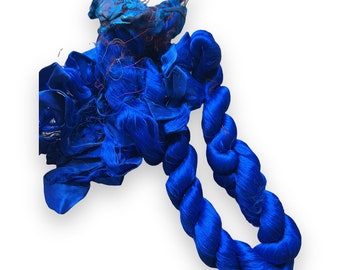Thrum silk fibers. pure silk with woven sari silk fabric attached. Spinning, embroidery, sewing. Stunning indigo blue.