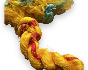 Thrum silk fibers. pure silk with woven sari silk fabric attached. Spinning, embroidery, sewing. Gold.