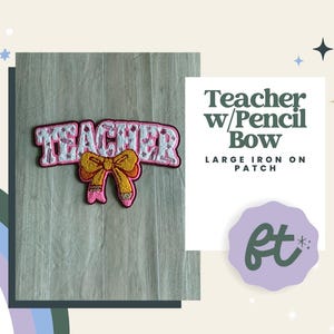 May include: An iron-on patch featuring the word TEACHER in white letters with a pink outline, centered above a yellow bow with a pencil-tip design. The text Teacher w/Pencil Bow LARGE IRON ON PATCH is displayed to the right of the patch.
