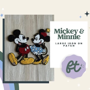 May include: An embroidered iron-on patch featuring Mickey and Minnie Mouse. Mickey wears red shorts and yellow shoes, while Minnie wears a blue polka-dot skirt and yellow heels. The text reads Mickey & Minnie LARGE IRON ON PATCH.