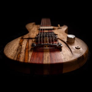 The Dord - Black Limba & Bloodwood. Highest Quality Handmade Electric Guitar. Plays like no other guitar. Made in the USA. Comes with Case.
