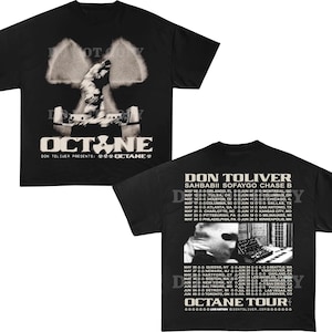 May include: Black t-shirt featuring a graphic design with the word "OCTANE" and a stylized image. The back of the shirt lists tour dates for Don Toliver's "OCTANE TOUR".