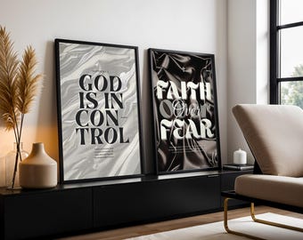 May include: Two framed art prints with black frames. One print features the text "GOD IS IN CONTROL" on a gray and white marbled background. The other print says "FAITH Over FEAR" on a black, textured background.