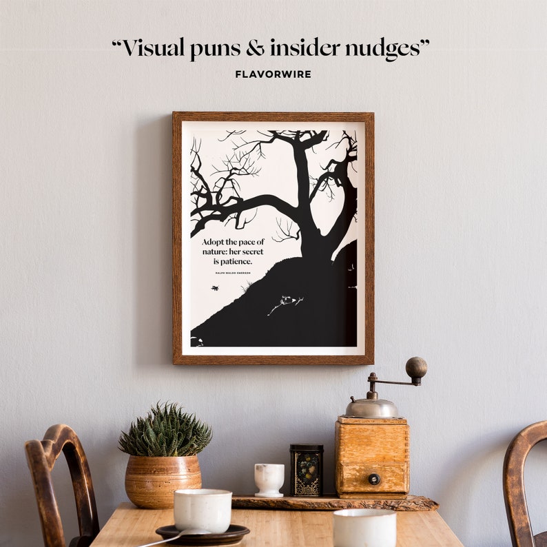 May include: Black and white print with a quote about nature and patience. The quote reads "Adopt the pace of nature: her secret is patience." The print is framed in a brown wood frame and is hanging on a light gray wall.