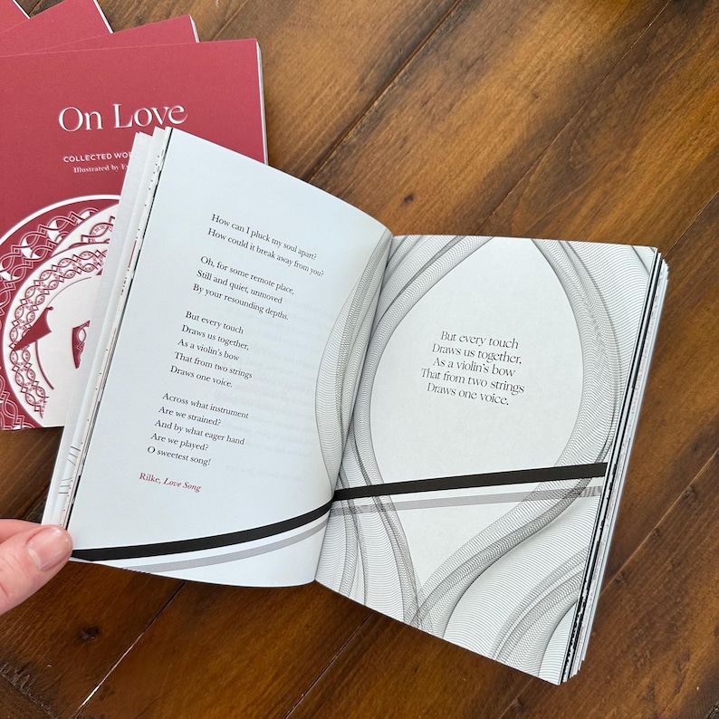 May include: An open book with a white background and black text. The book is titled "On Love" and features a poem by Rilke. The poem is about love and how it draws two people together.