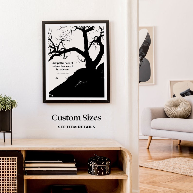 May include: Black and white print of a tree with the quote "Adopt the pace of nature: her secret is patience." The print is framed and hanging on a white wall. The text "Custom Sizes" and "SEE ITEM DETAILS" is below the print.