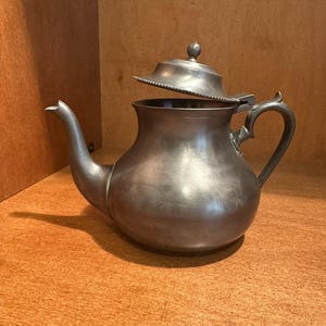 May include: A handmade wooden sign with the text "Welcome" in a handwritten style. The sign is painted white with a distressed finish and features a small, decorative heart. Perfect for a front door or entryway.