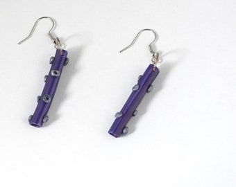 Funky Purple Tubes with Silver Circles Dangle From a Silver Circle