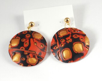 Enjoy red, black and gold Domed Dangles on a gold post!