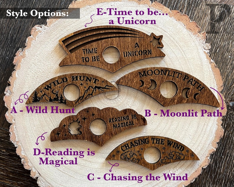 May include: Five wooden cutouts with different designs and text. The designs include a crescent moon, a cloud, a unicorn, a mountain range, and a star. The text includes "Time to be a Unicorn", "Wild Hunt", "Moonlit Path", "Reading is Magical", and "Chasing the Wind".