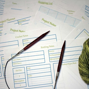 May include: A printable craft project planner with sections for project notes, knitting notes, crochet notes, and a shopping list. The planner includes a grid for yarn calculations and a space for a yarn sample.