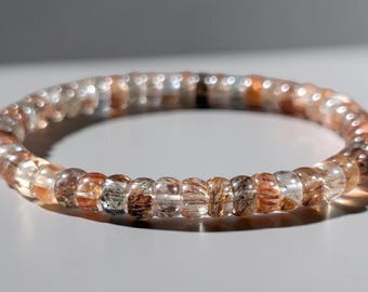 Armband i naturlig svart guld med rutilerad kvarts i rondellpärla - Kristallsmycken