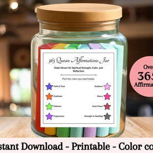 May include: A glass jar with a wooden lid filled with colourful cards. The jar has a label that reads "365 Quran Affirmations Jar" with daily verses for spiritual strength, calm, and reflection. A pink circle says "Over 365+ Affirmations".