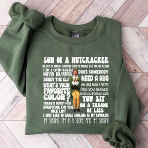 Son Of A Nutcracker Buddy The Elf Ugly Christmas Sweatshirt, Funny Christmas Sweatshirt Son of a Nutcracker Sweater, Christmas Family Gift