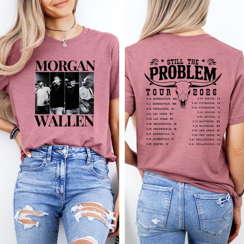 May include: A mauve-colored t-shirt featuring a black and white image of Morgan Wallen and the text "MORGAN WALLEN". The back of the shirt displays "STILL THE PROBLEM TOUR 2026" with a bull skull graphic and tour dates.