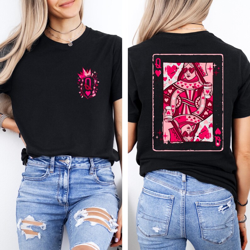 May include: Black t-shirt with a pink graphic of a queen of hearts playing card on the back. The front of the shirt has a smaller pink design with a crown and the letter "Q". The shirt is paired with blue jeans.