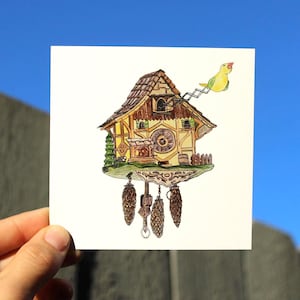 May include: A whimsical watercolor illustration of a cuckoo clock. The clock features a detailed wooden design with a clock face, a small bird perched on top, and hanging pinecone weights. The artwork is set against a bright blue sky.