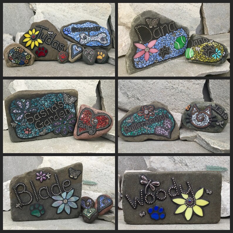 May include: Hand-painted decorative rocks with names, flowers, and paw prints. The rocks feature mosaic designs, butterflies, and the names "Tudas", "Cooper", "Dana", "Sasha's Garden", "Butterscotch", "Blade", and "Woody".