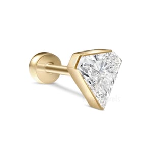 May include: A gold-colored stud earring featuring a large, triangular-cut diamond. The diamond is set in a bezel setting, and the earring has a flat back for comfortable wear. The design is simple yet elegant, suitable for everyday wear or special occasions.