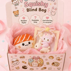 May include: A "Pawkemon Squishy Blind Bag" box, open to reveal a sushi-shaped squishy and a pink bunny figure. The box is decorated with cartoon characters and the text "Random Styles" and "Each blind bag is a surprise".