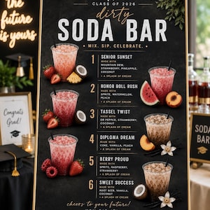 May include: A black chalkboard sign with a gold frame displays a "dirty soda bar" menu for a graduation celebration. The menu features six soda concoctions with ingredients like strawberry, coconut, and vanilla. Fresh fruit and garnishes are arranged around the drinks.