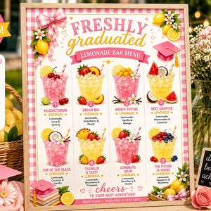 May include: A framed "Freshly Graduated Lemonade Bar Menu" sign with various lemonade flavors. The sign features pink and yellow graphics, including lemons, graduation caps, and drink illustrations. A basket of lemons and pink flowers are in the background.