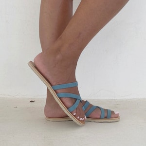 Side view of the barefoot leather sandal showing the thin minimalist profile