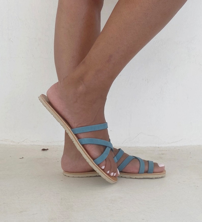 Side view of the barefoot leather sandal showing the thin minimalist profile