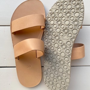 Close up of handmade leather slide sandals detail