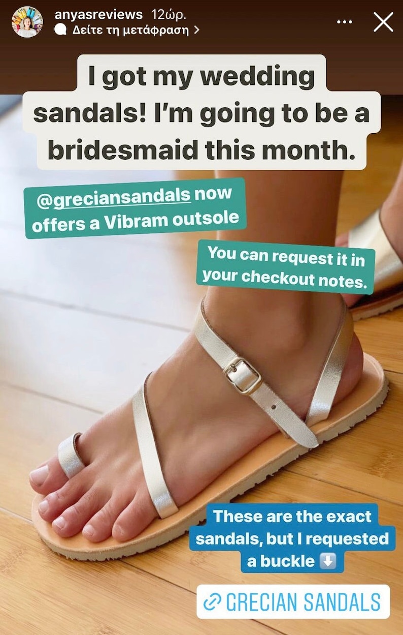 May include: A pair of metallic silver sandals featuring a toe loop, thin straps, and a metal buckle closure. The footwear includes a light-colored sole with a textured Vibram outsole. The text on the image reads: I got my wedding sandals! I'm going to be a bridesmaid this month. @greciansandals now offers a Vibram outsole. You can request it in your checkout notes. These are the exact sandals, but I requested a buckle. GRECIAN SANDALS.