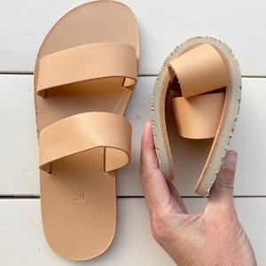 Flexible barefoot leather sandals with Vibram sole bending