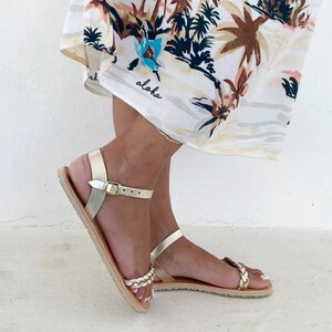Can see the barefoot vibram sole, and gold leather