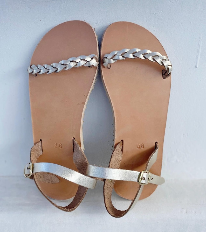 Top-down view of gold barefoot slides, showing the wide toe box that allows toes to spread naturally for maximum foot health and comfort.