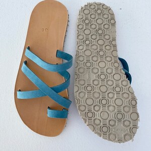 The bottom of the sandal showing the Vibram sole, highlighting the slip-resistant pattern and durable material."